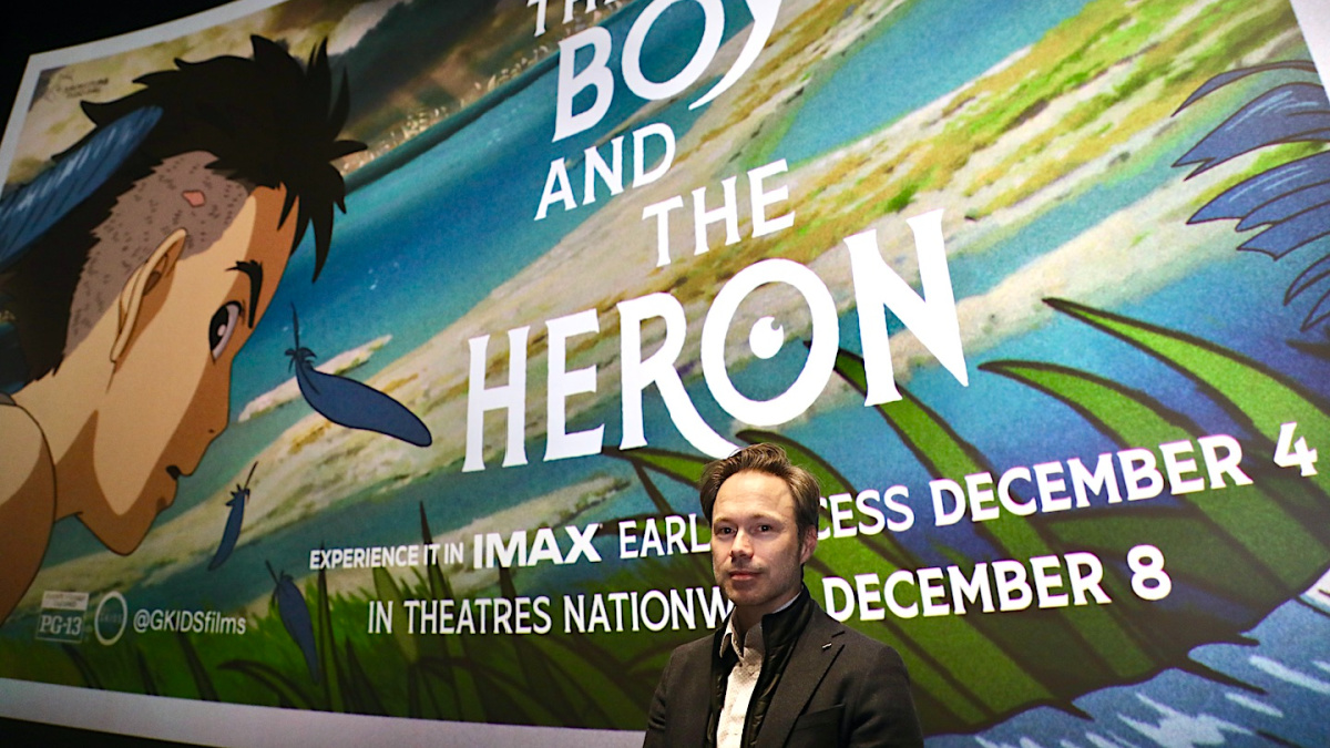 Michael Sinterniklaas Standing in Front of The Boy and the Heron Poster